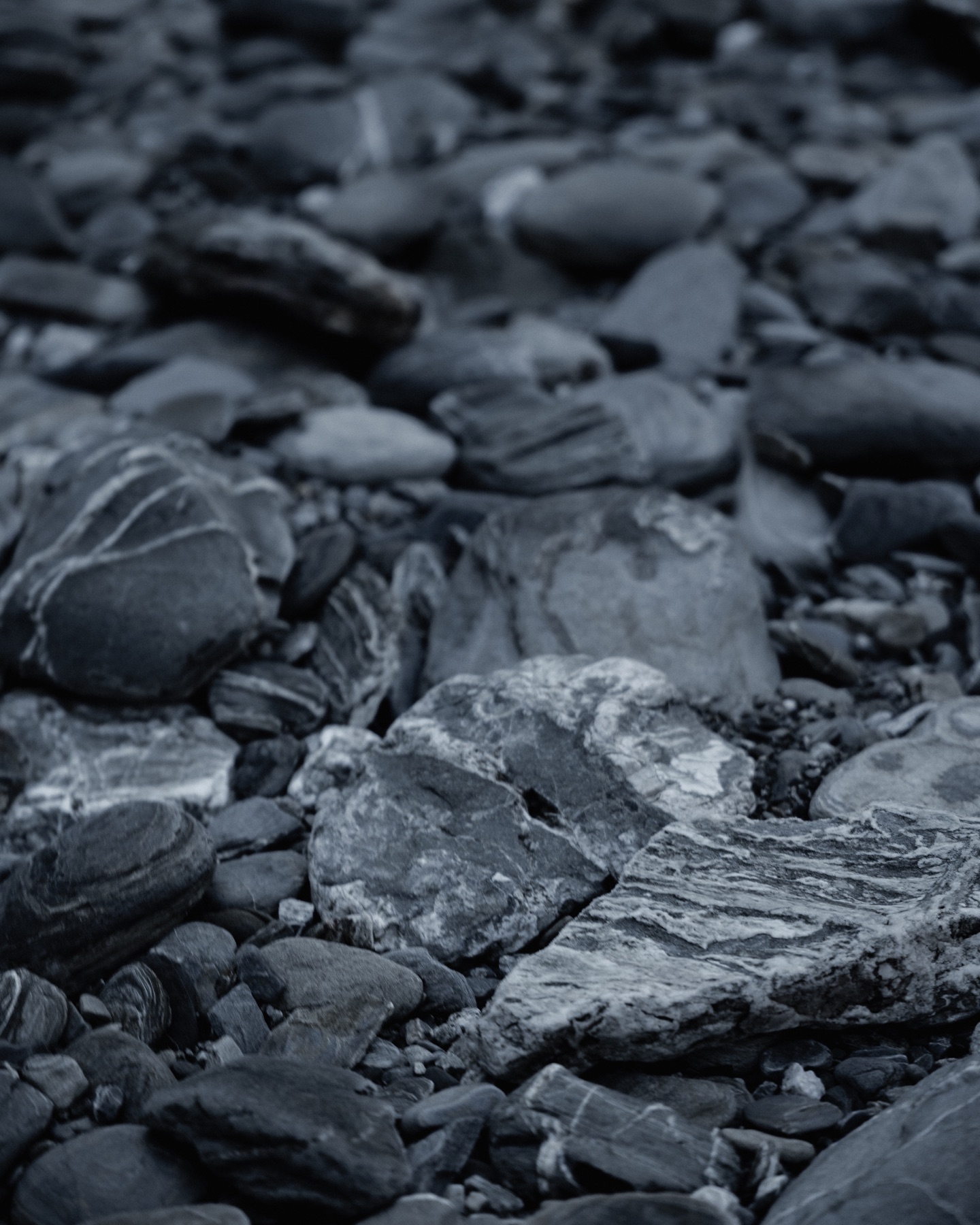 Blue-grey river stones in soft focus